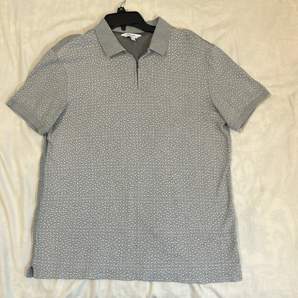Calvin Klein zip up polo. Gray with white geo pattern. Size Large. Great cond.